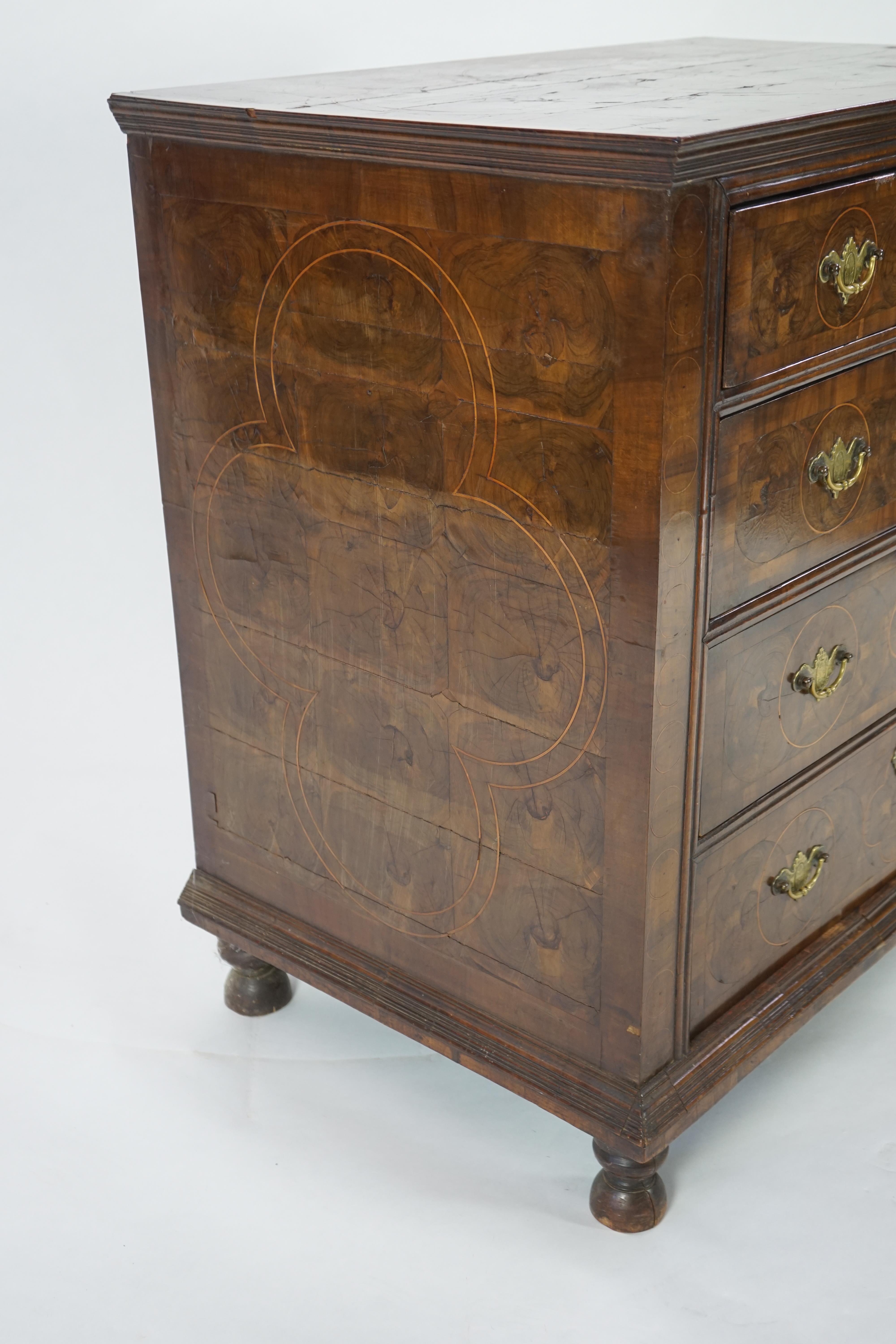 A William and Mary oyster veneered laburnum and walnut chest